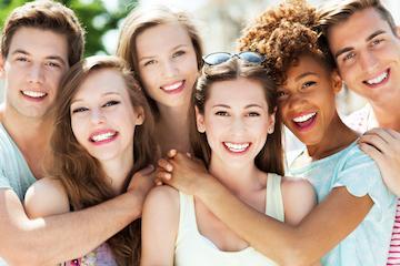 Group of dental patients smiling in Aston PA