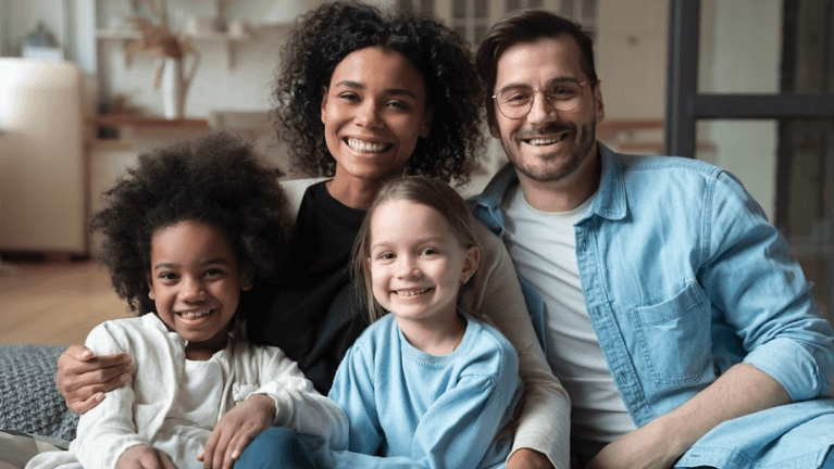 Happy family smiling after dental check ups in Aston, PA