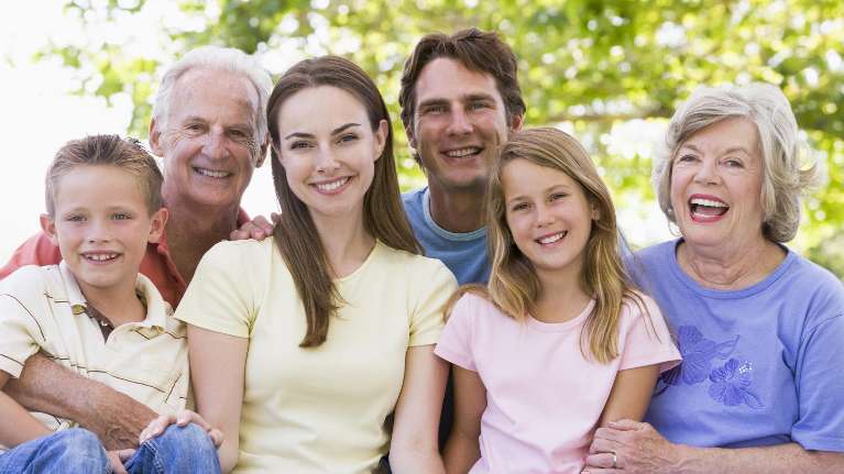 Family smiling after teeth cleaning session in Aston, PA