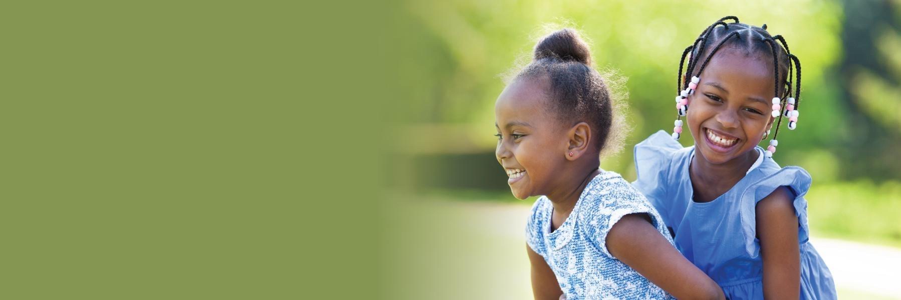 Two childrens dentistry patients playing outside near Aston PA