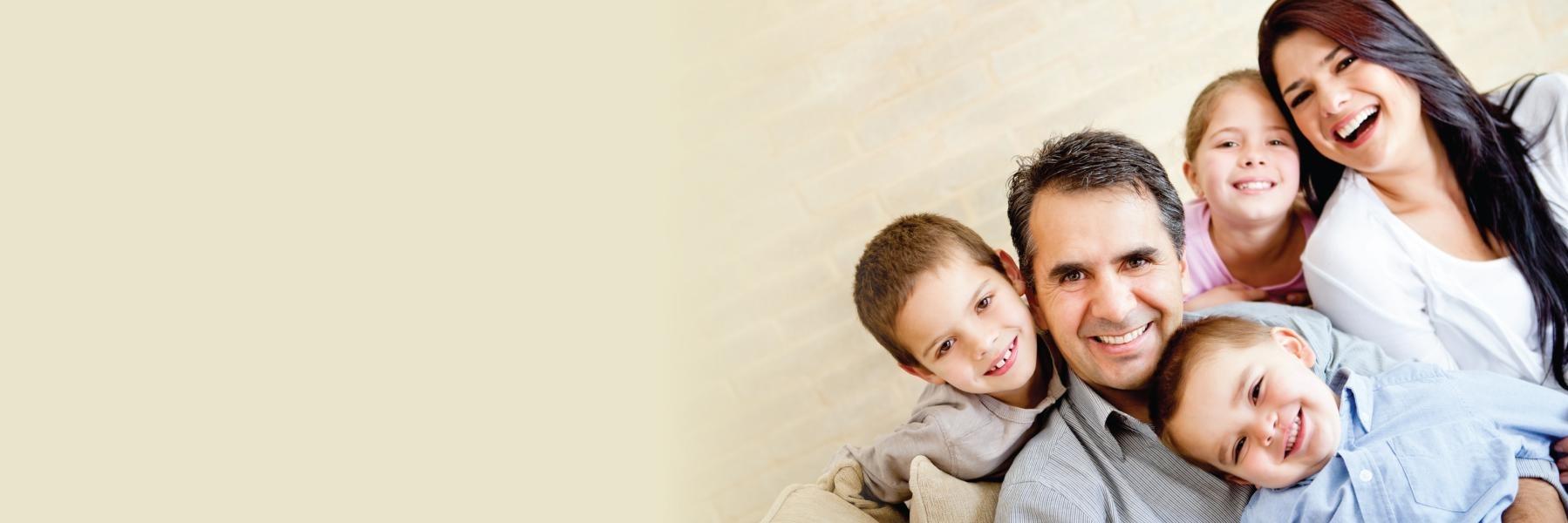 Family of general dentistry patients smiling near Aston PA