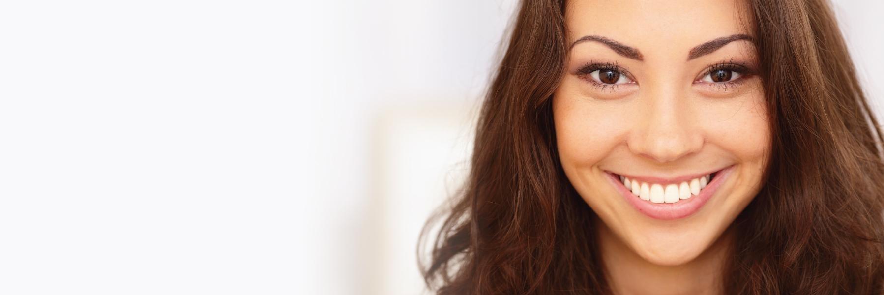 Patient smiling after teeth whitening in Aston, PA
